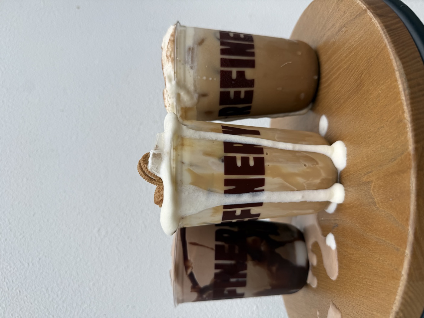 Three cold foam iced coffees — choc fudge, cookies-and-cream and cinnamon — at Refinery Coffee cafe, Currumbin