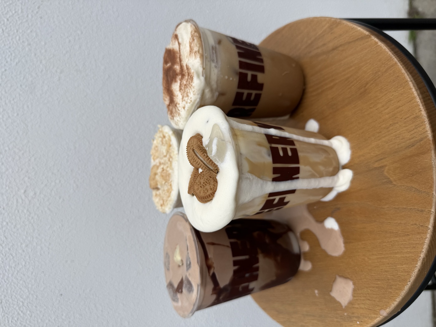 Four cold foam iced coffees topped with cookies, crumble, cinnamon and chocolate at Refinery Coffee cafe, Currumbin