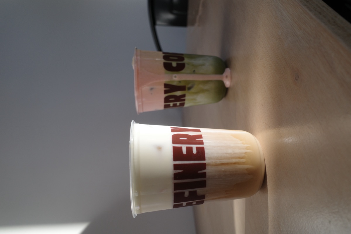 Iced latte with cold foam in a Refinery Coffee cup, Currumbin cafe